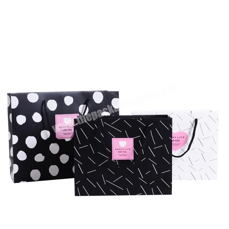 Yiwu unique boutique stylish string polka dot black gift paper bag