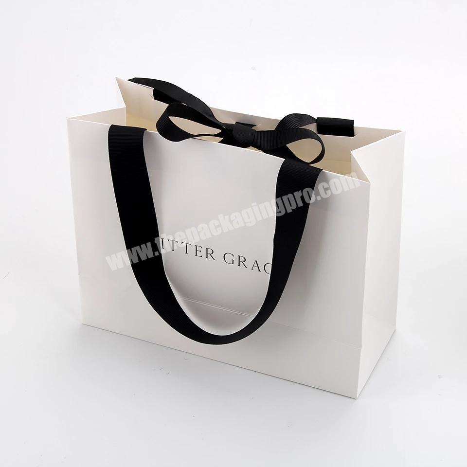 Wholesale paper bags custom logo clothes paper bag White paper bags with logo ribbon handle