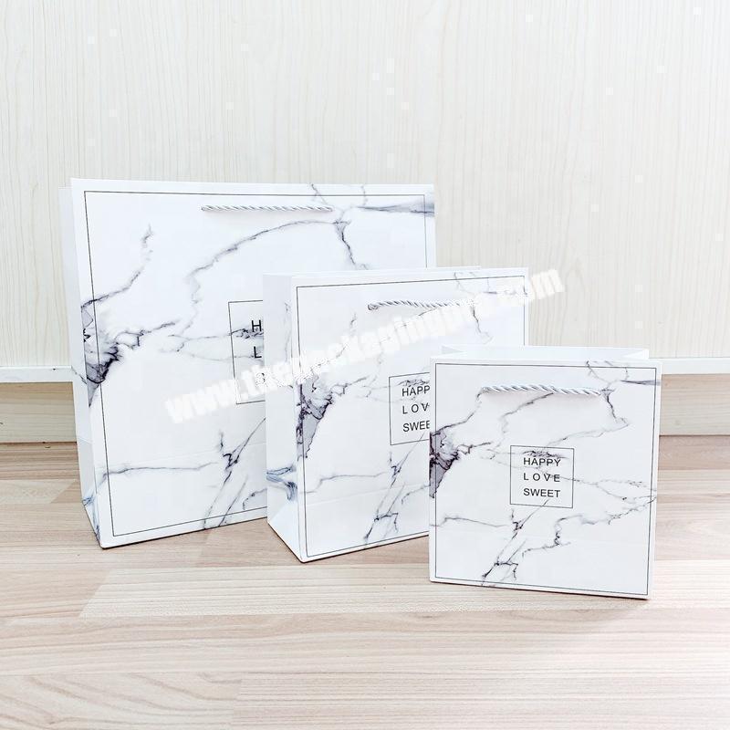 China Manufacturer White Luxury Packaging Gift Paper Bag Kraft Clothes Paper Bags Marbling Shopping Paper Bag With Your Own Logo