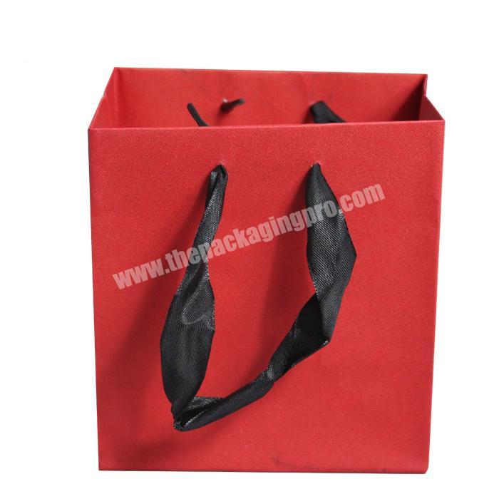 Manufacturers sell at low prices paper shopping bags with ribbon handle