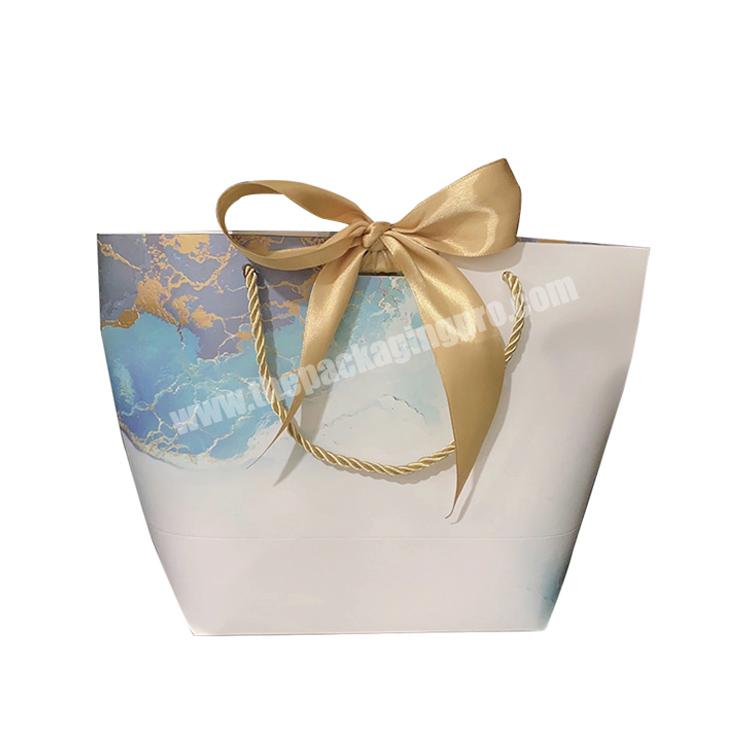 Wholesale customized skin care bags packaging cosmetic art paper bags with logo