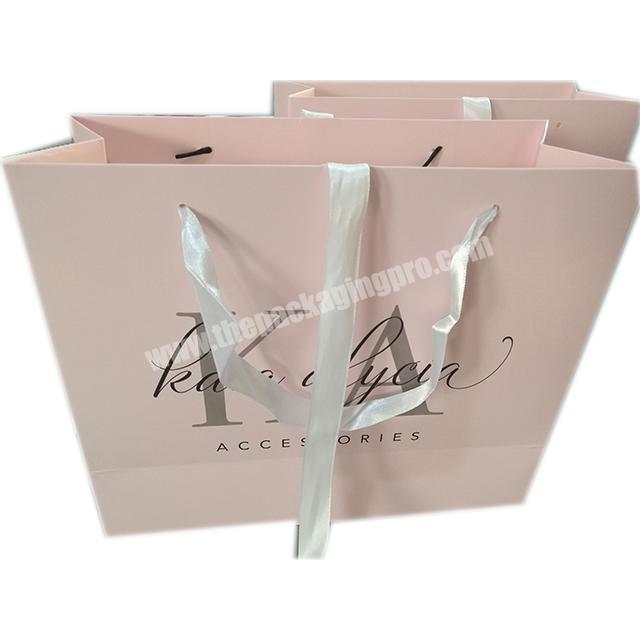 Custom Logo Printing Large Advertising warm pink Paper Bag with ribbon bow and white rope handle