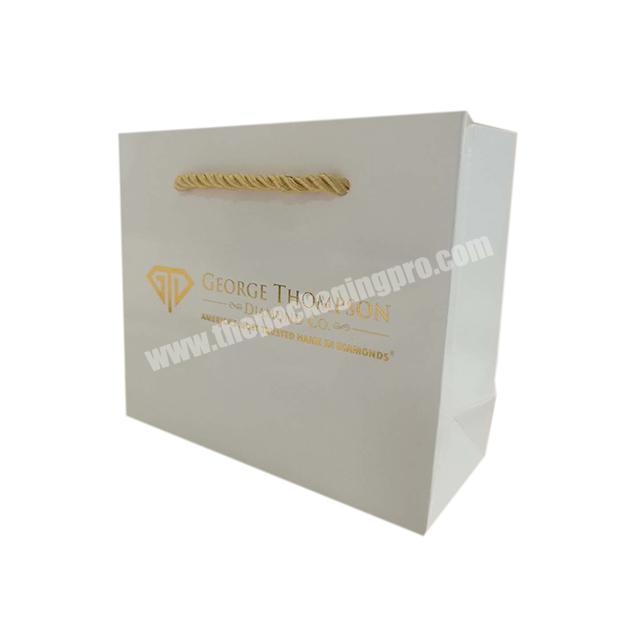 Luxury white Gift Paper Bag Custom gold foil logo Jewelry Packaging Kraft Shopping Paper Bag With gold rope Handles