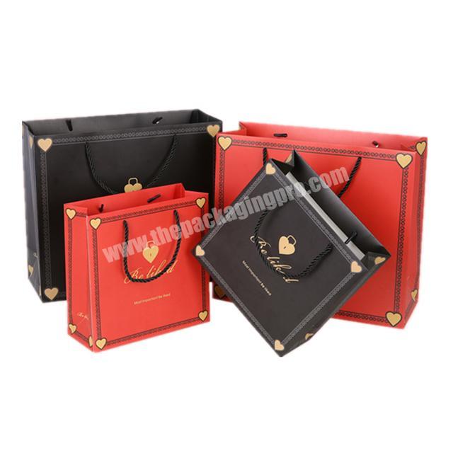 High-end luxury blackred gift bag Professional printing gold foil paper bag with heart