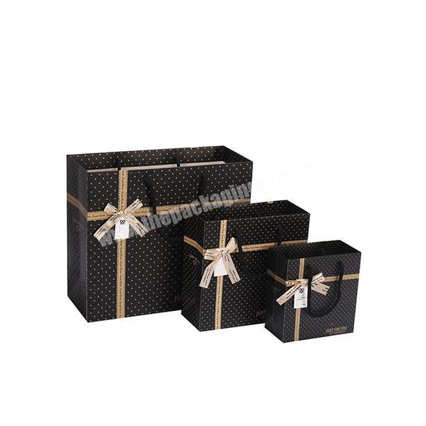 Latest design gift bags custom printed on glossy paper luxury shopping gift paper bag high-end paper gift bags with handles