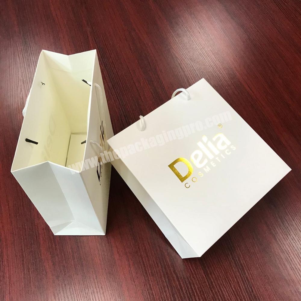 Wholesale small retail package cosmetic paper bag with logo