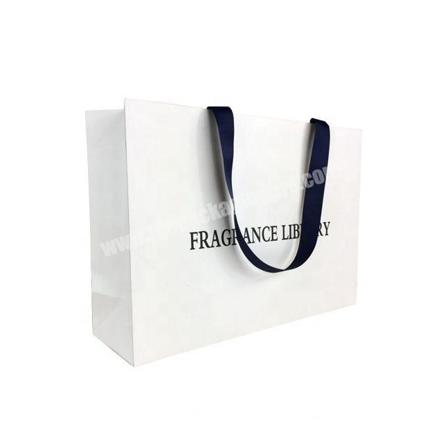 Free design custom printing white garment paper packaging bag with hidden ribbon handle