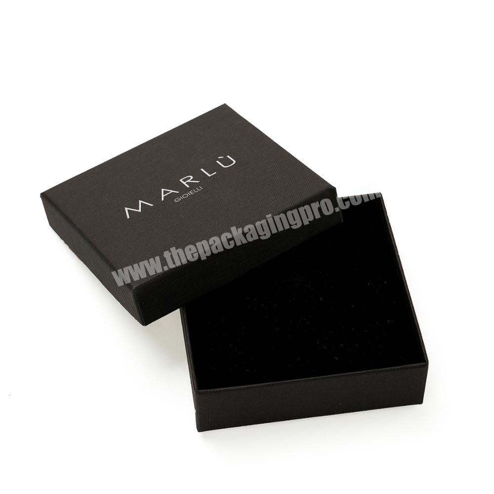 Simple black paper box with logo in silver hotstamping