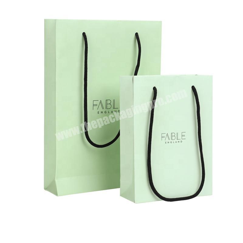 Hot selling green white paper bag with logo printed in black