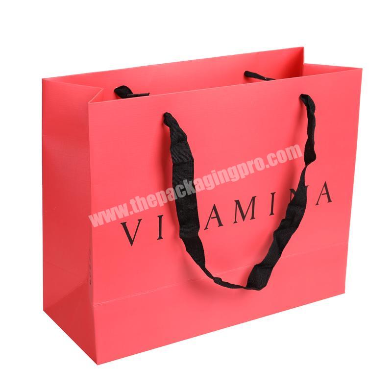 Red 230g textured paper Argentina clothing bags  with logos embossed