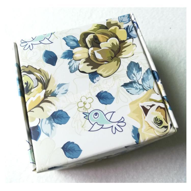 Small gift boxes with colorful floral patterns are customized for low volume prices