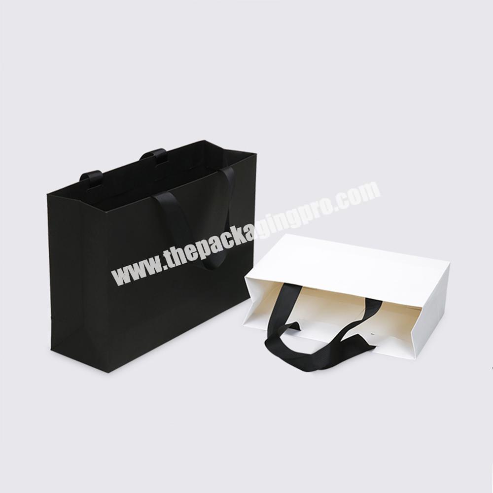 Top quality ribbon handle custom logo printed packaging paper bags for clothes and cosmetic