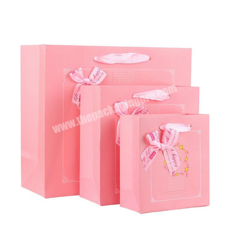 High quality customizable pink paper gift bags,packaging paper bags for clothes