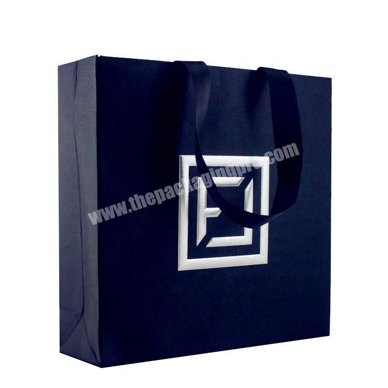 The new hot sell gift paper packaging bags black paper bags with your own logo