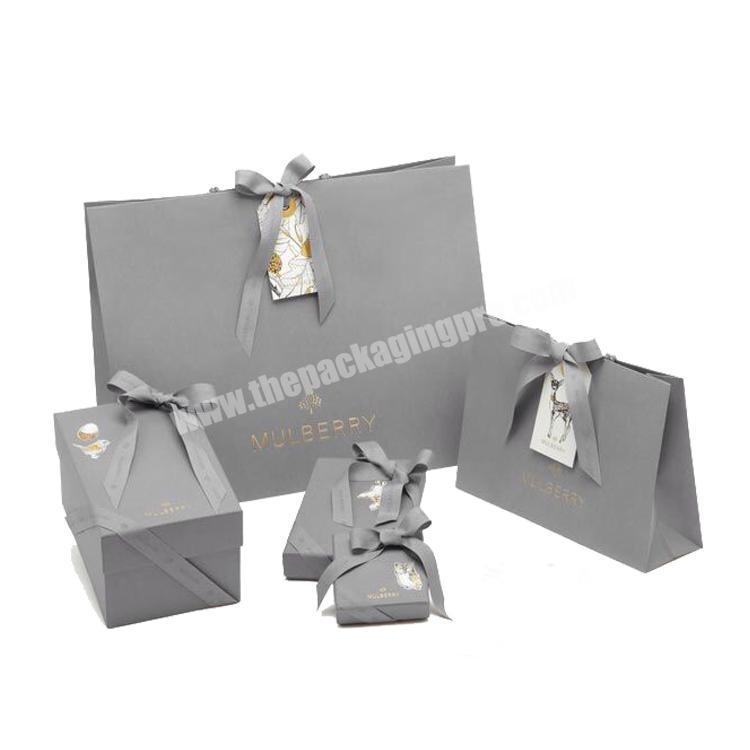 Custom Paper Bag Kraft Paper Shopping Gift Shoes and Clothing Packaging Bag from China Pantone OEM Customized Gsm