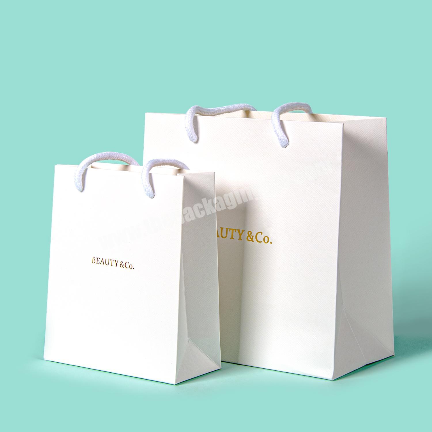 Custom logo 250g white cardboard sturdy paper fancy gift bag for shopping