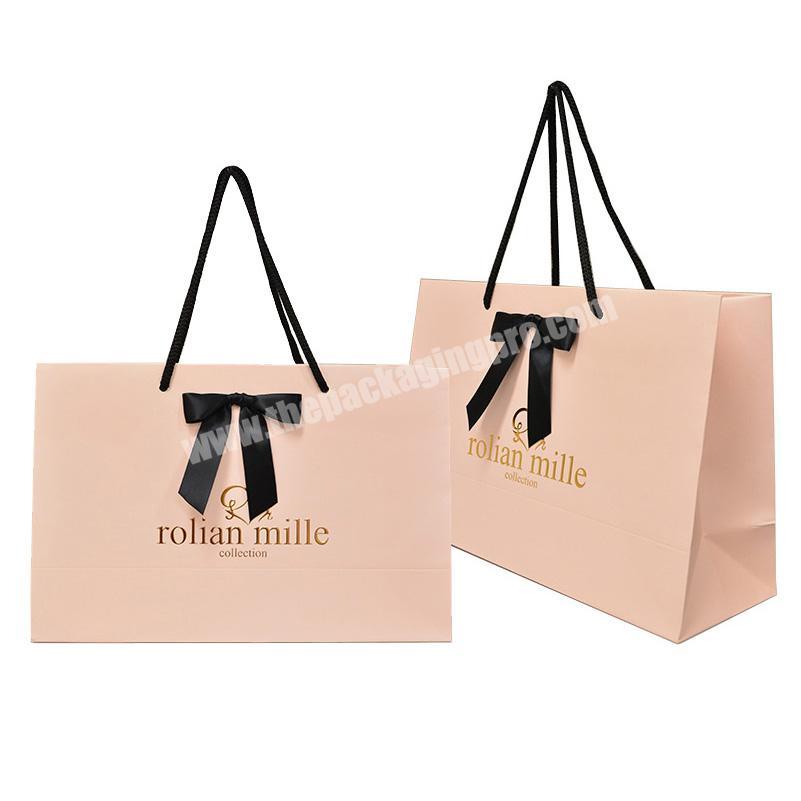 Factory price wholesale luxury pink paper shopping bags custom printed logo