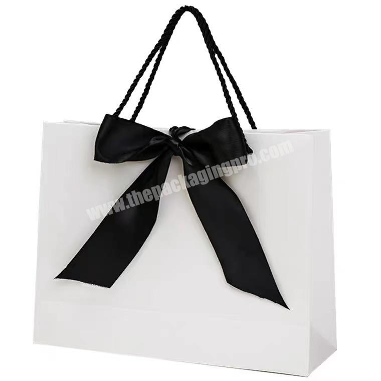 Luxury white shopping paper bag with logo for clothing packaging gift bags with your own customized printed
