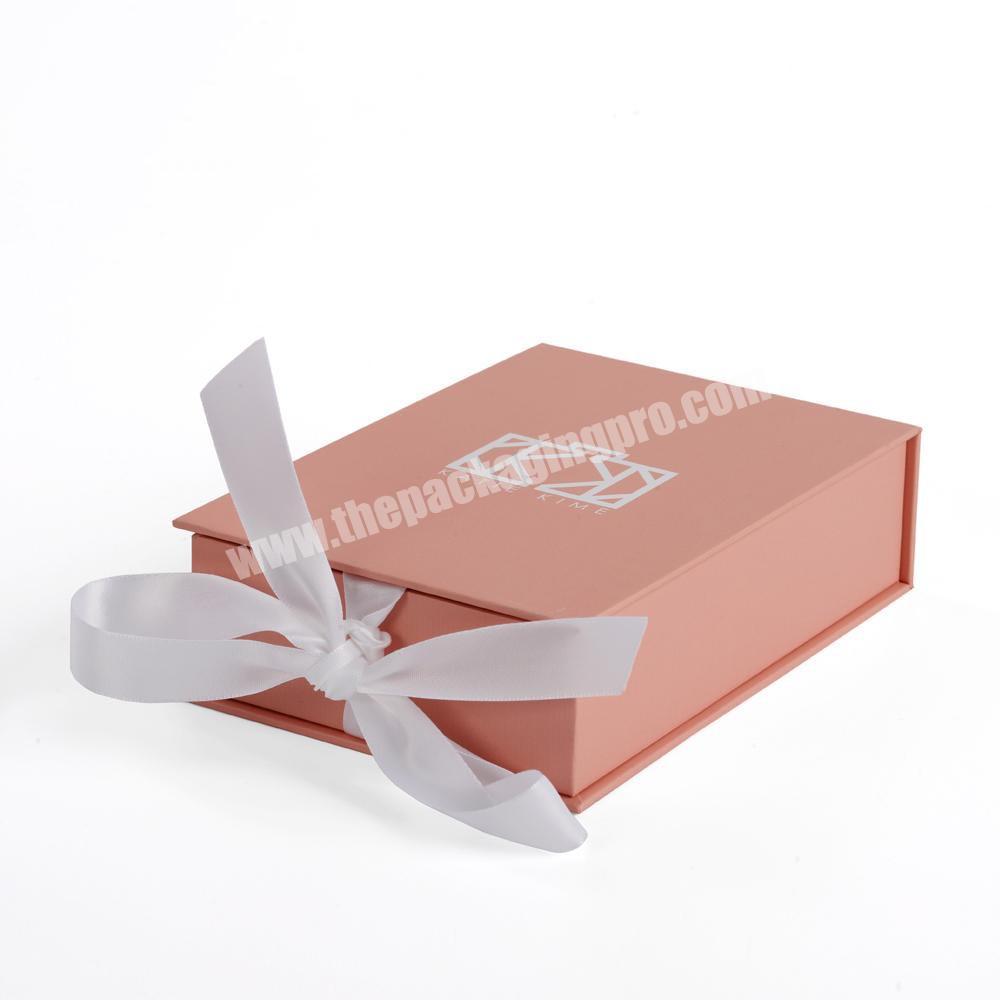 Pink cardboard small magnetic gift box with ribbon