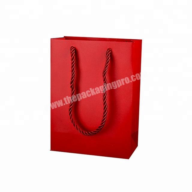 Promotion Fancy Chinese women apparel diecut red art paper packaging gift bags packaging