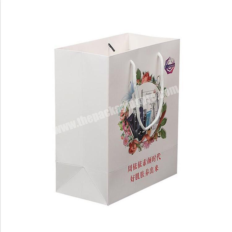 Wholesale Custom Print Gift Packaging Kraft Paper Bag With Ribbon Handles For Skincare Packaging