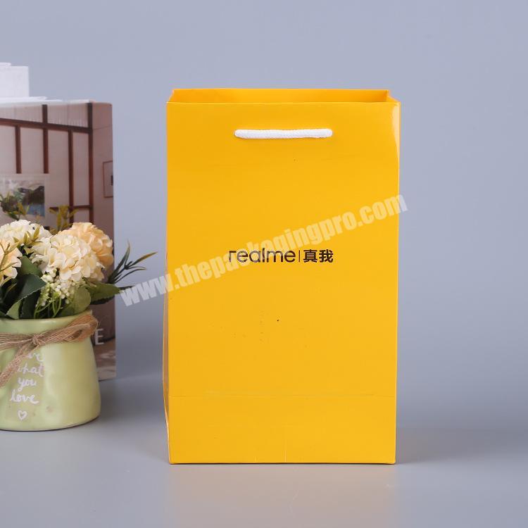Wholesale custom printed yellow luxury shopping gift paper bag with handle