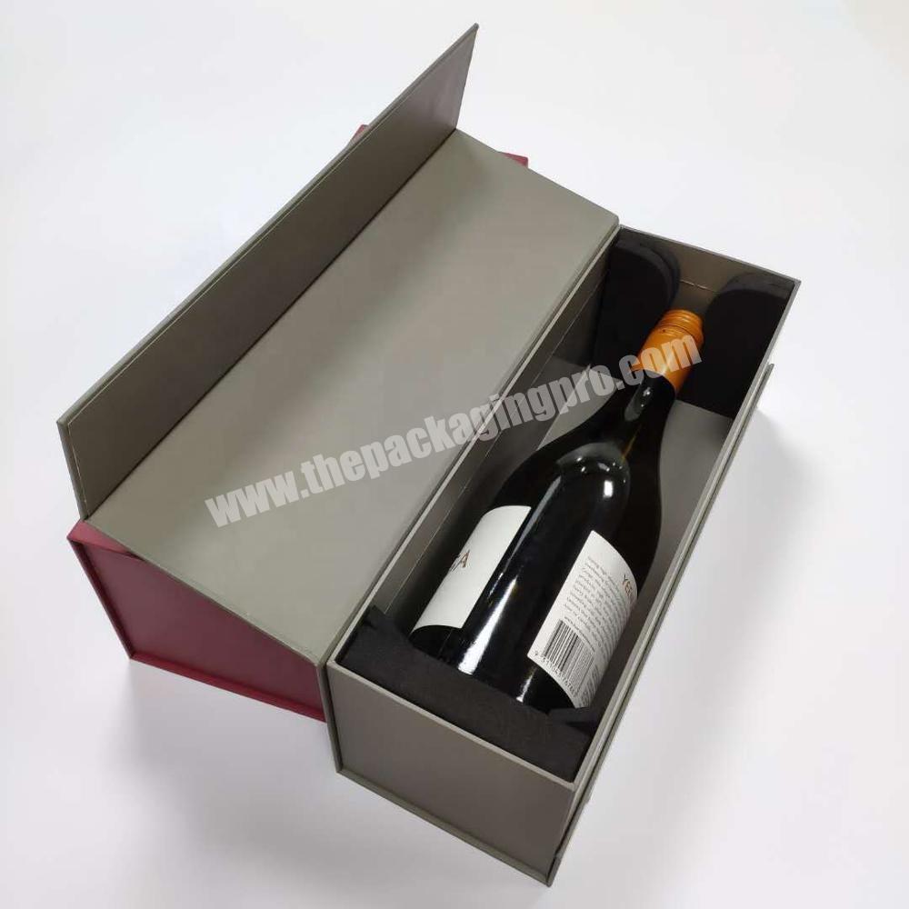 Red wine gift box with magnetic lid and insert to hold beverage bottle