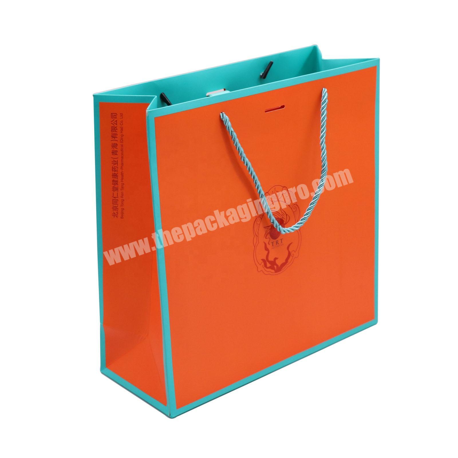 Custom bolsa de papel eid paper gift bag with twist handle premium paper shopping bags for clothing luxury printed paper bags