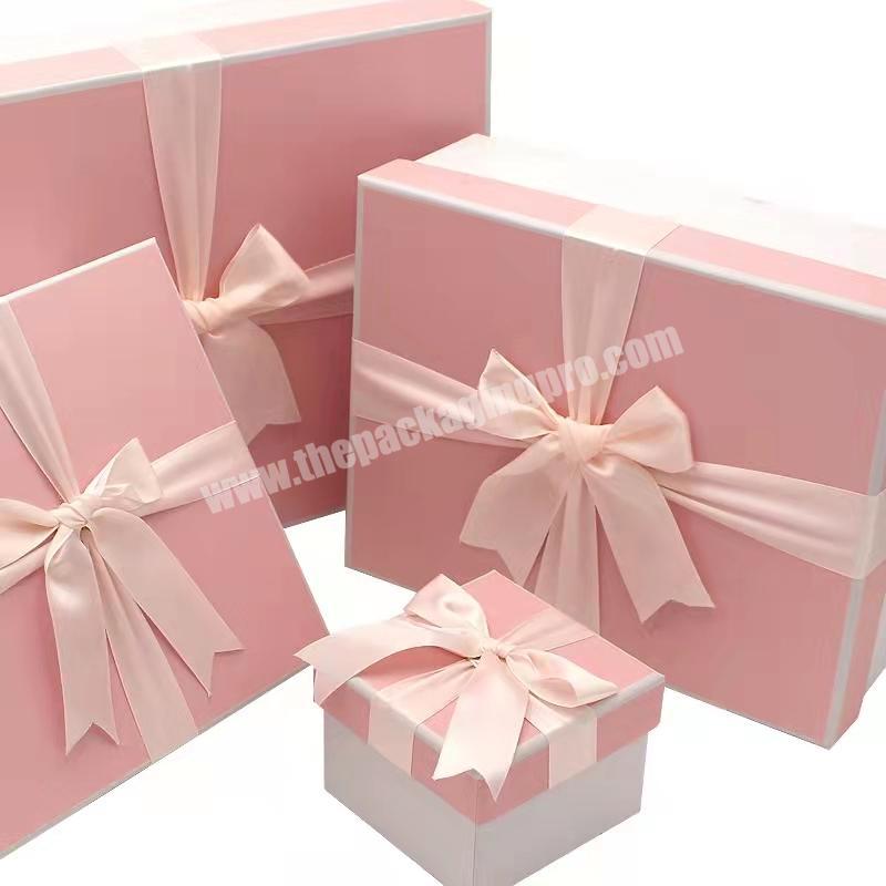 Custom logo wholesale luxury pink rigid cardboard gift box handbags cosmetic gift packaging box with ribbon