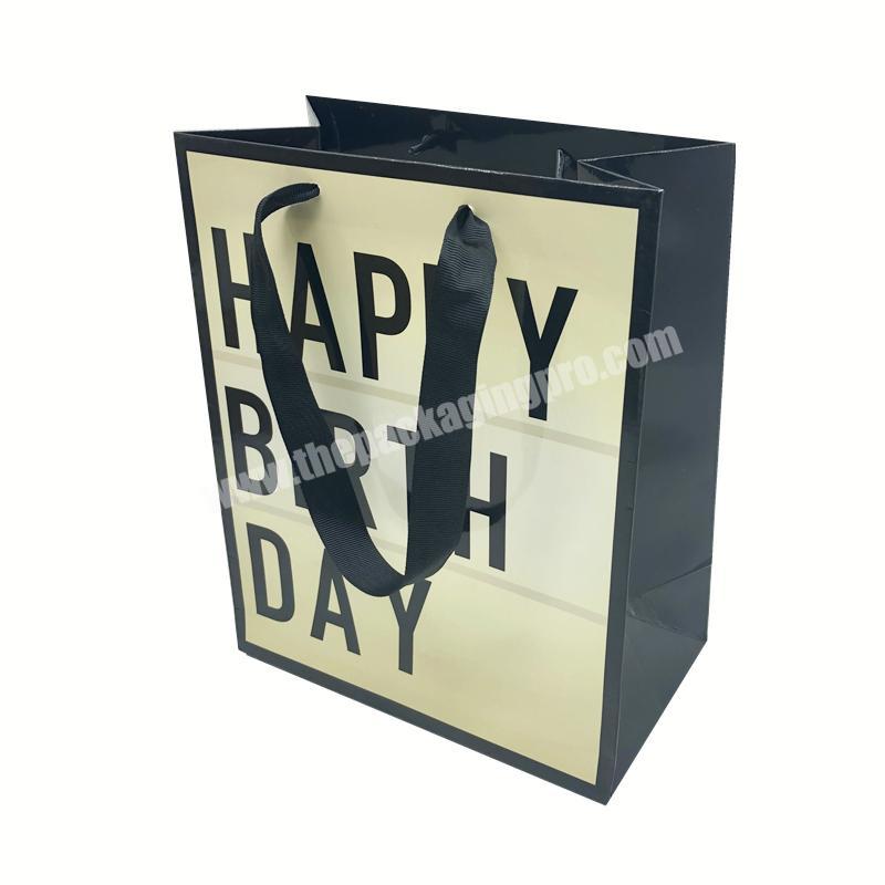 Custom your brand logo A4 size high-end luxury paper bags glossy lamination birthday gift bags with ribbon handles