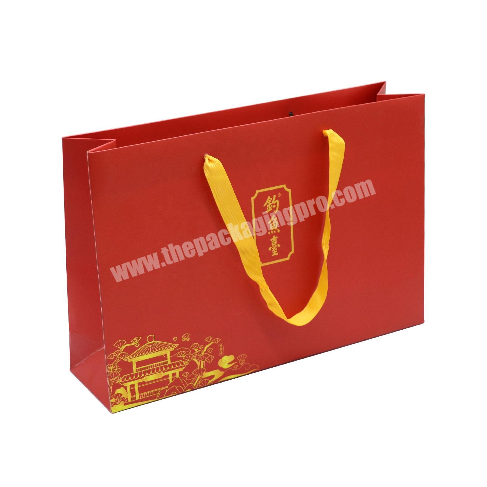 Customization bolsa de papel eid paper gift bag with ribbon handle premium clothing paper shopping bag luxury printed paper bags