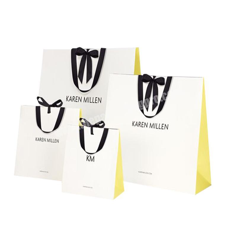 Fancy design gold print white paper bag Jewelry paper gift bags with handles