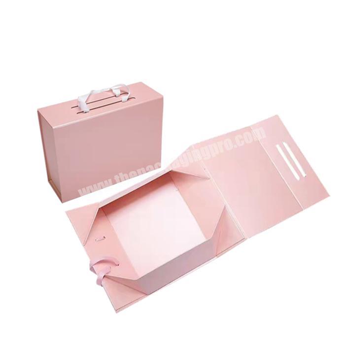 Luxury custom printing logo pink folding cardboard gift box magnetic flip packaging box for handbag with ribbon handle