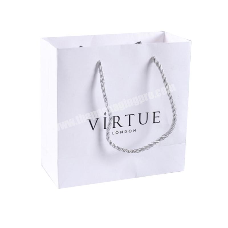 Wholesale retail embossing eco friendly foldable recyclable custom logo white paper bag with handle