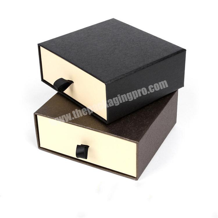 black cardboard paper package slide out box
