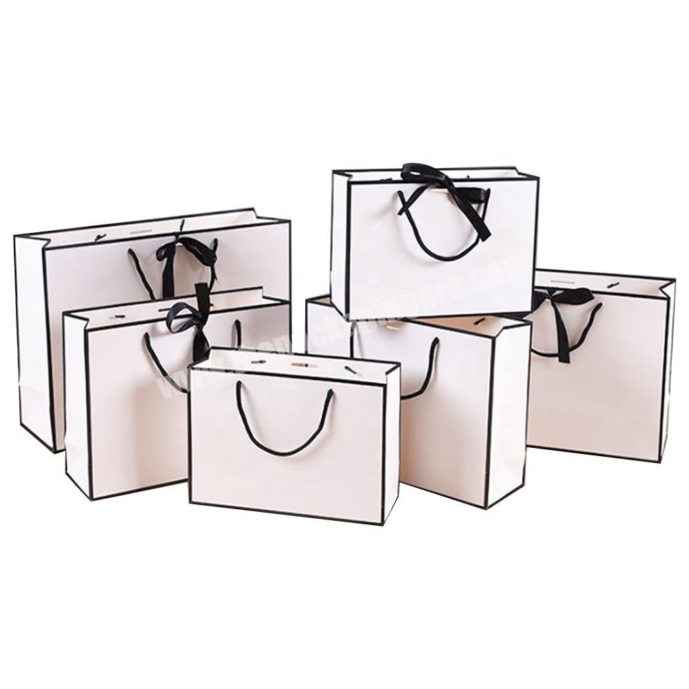 wholesale black and white foldable kraft paper bags with ribbon for wedding gift jewellery cardboard shopping bags
