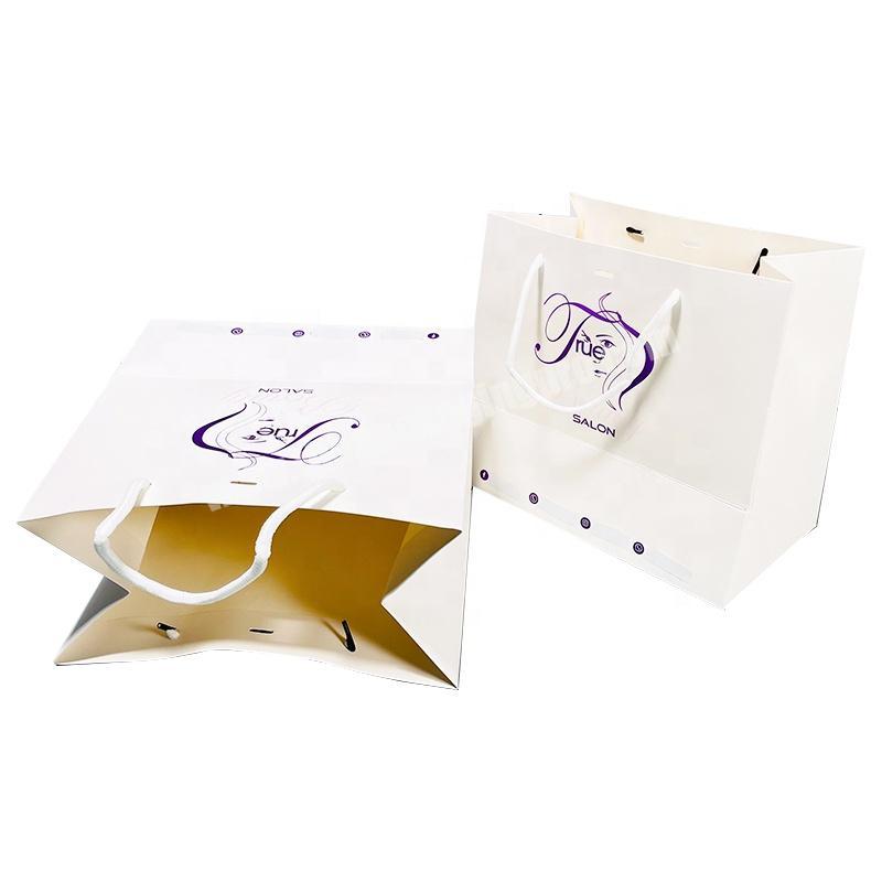 wholesale custom print white luxury clothes cosmetics shopping paper packaging bags handles with your own logo