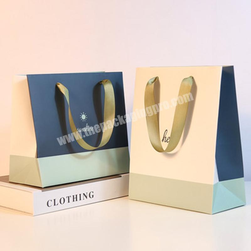 Luxury kraft paper bag gift paper bags with ribbon handle for clothes