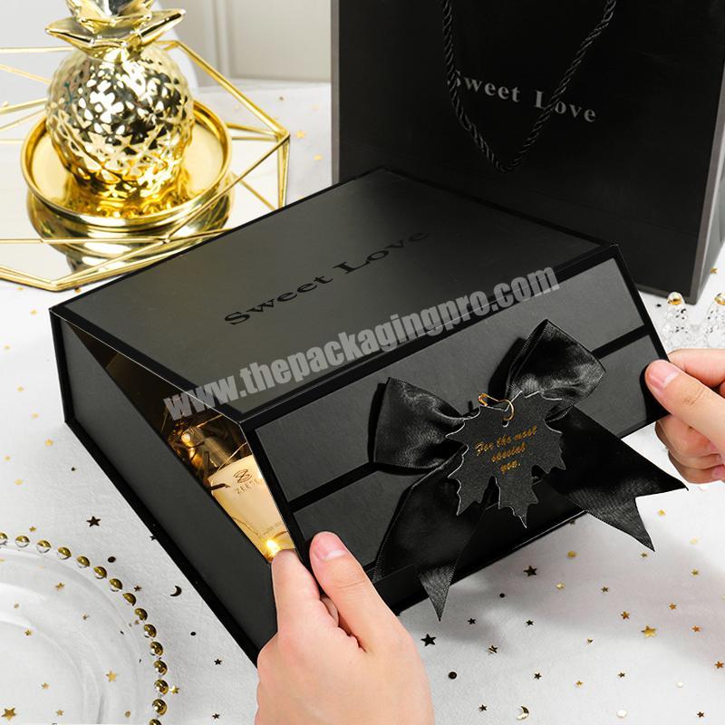 Luxury matt black foldable paper cosmetic lip gloss packaging boxes custom logo for cosmetics with gold logo ribbon closure