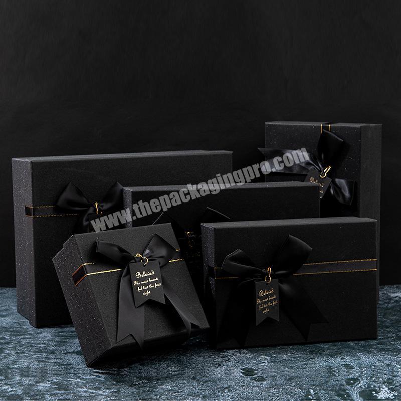 https://thepackagingpro.com/media/goods/images/2022/7/Luxury-square-black-paper-bag-shipping-storage-box-custom-logo-cardboard-cosmetics-clothing-packaging-box-wholesale-1.jpg