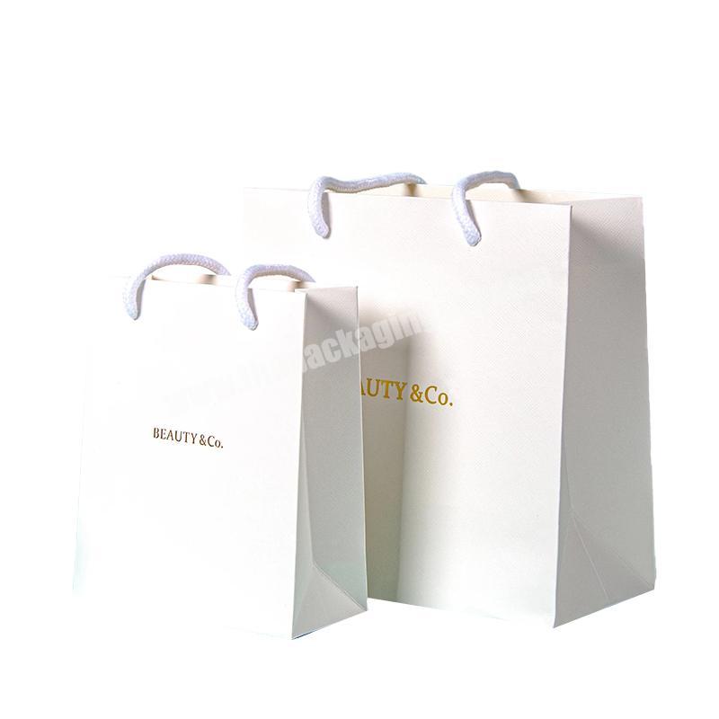 Wholesale gold stamping printed paper bag  high quality gift paper bag custom print logo white clothes paper bags