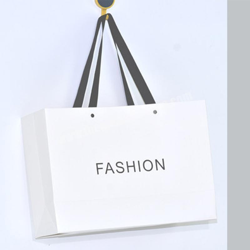Wholesale printed paper bag high quality gift paper bag custom print logo fashion white clothes paper bags