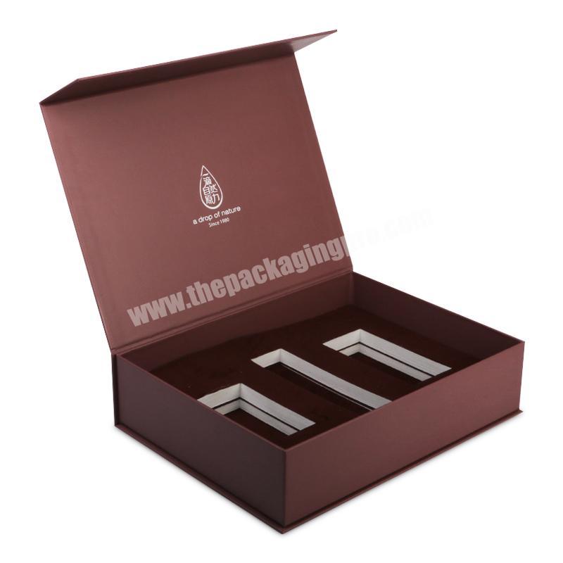 custom book shape magnetic cardboard cosmetic bottles set packaging box with cut out insert