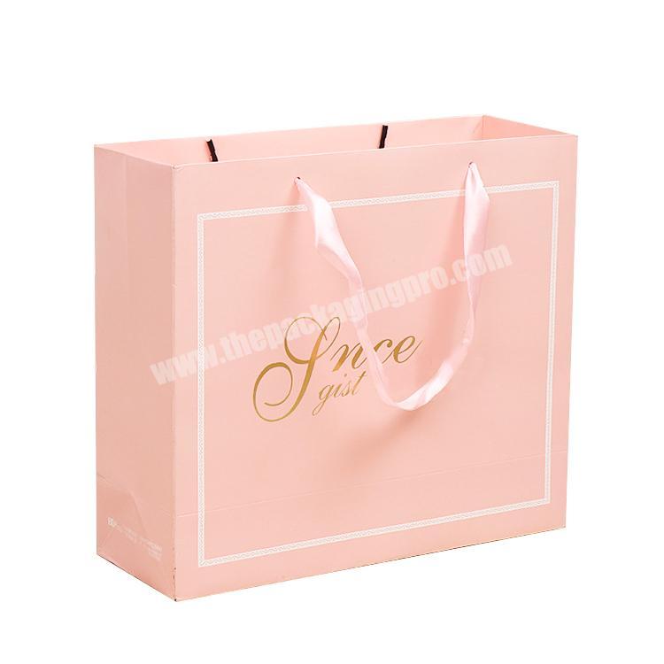 Beautiful pink paper dress bag clothing shopping bag with custom brand name