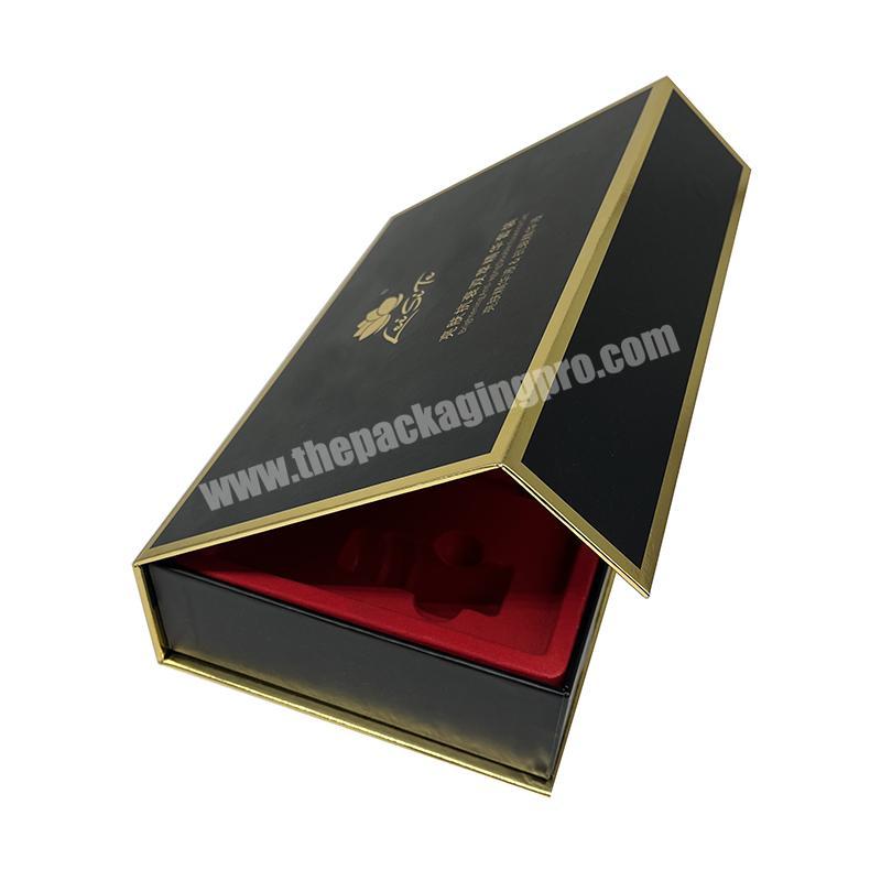 Black magnetic gift box with red flocking insert and golden border