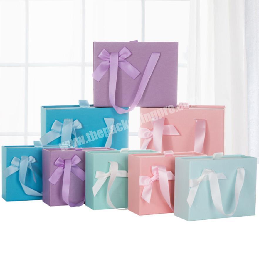 Cheaper handmade craft paperboard cosmetic packaging box with ribbon handle and bow for drawer box