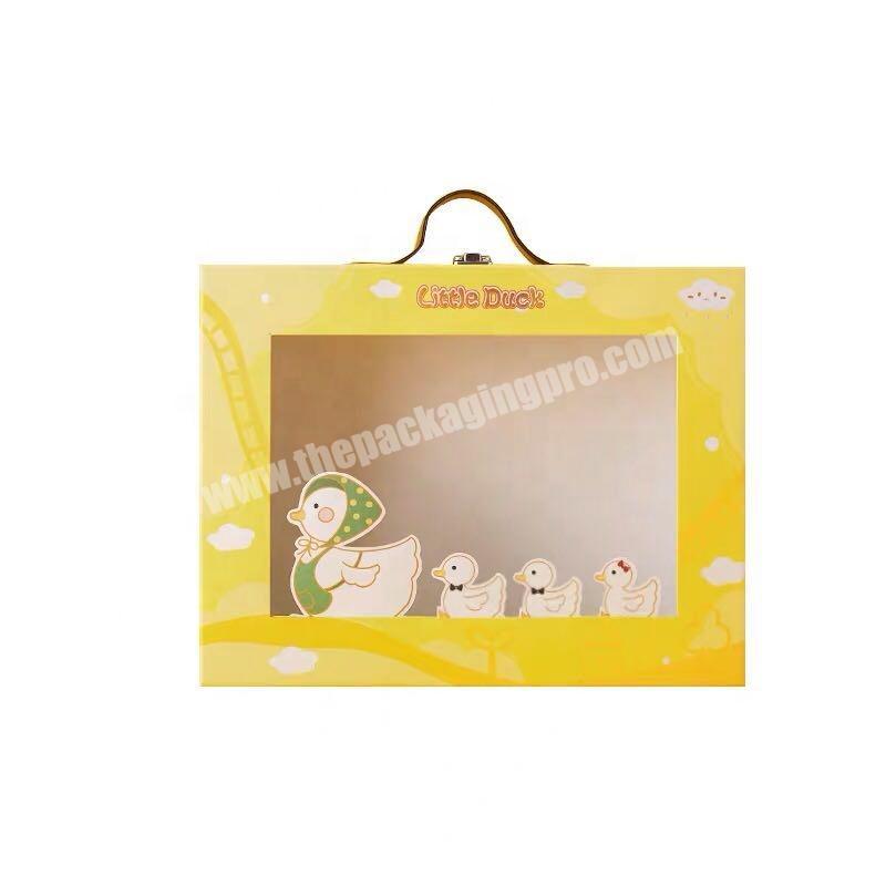 Children's collection of toys clothes and gift packaging boxes with transparent windows