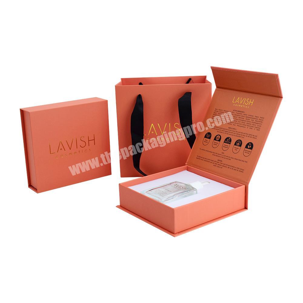 Custom Gold Foil Logo Stamped Rigid Paper Magnetic Box with Eva Foam Insert for Cosmetic Glass Bottle Packaging with Paper Bag factory