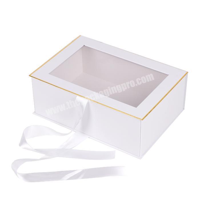 https://thepackagingpro.com/media/goods/images/2022/8/Custom-logo-fold-magnet-kraft-paper-box-clothing-folding-storage-box-gift-folding-boxes-with-pvc-window-and-ribbon-3.jpg