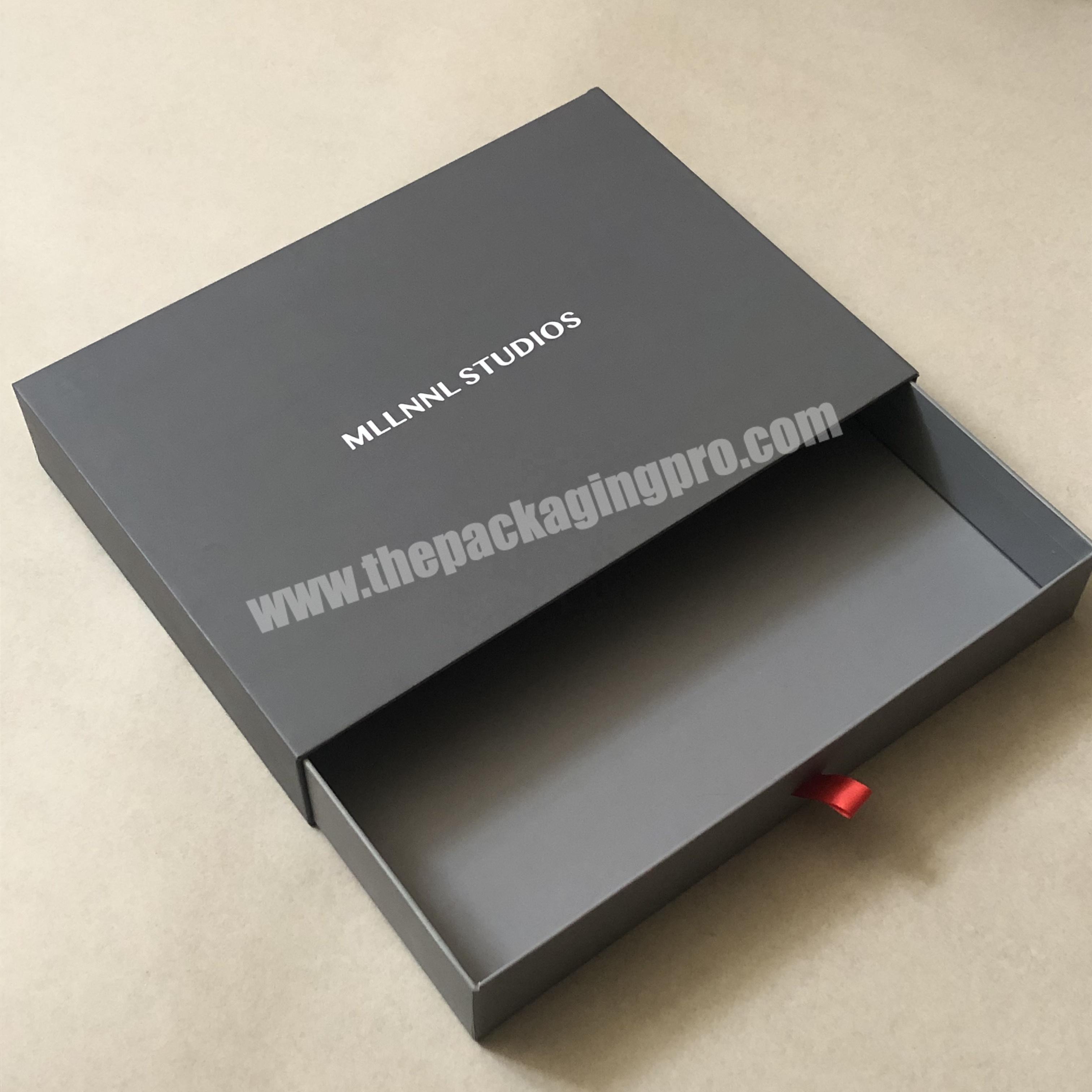 Matte paperboard sliding boxes with texture for luxury packing